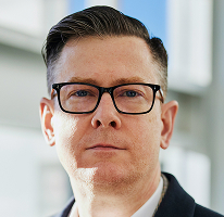 암호화폐 트레이딩 기업의 CEO 임원을 맡고 있는 Alexander Hughes 초상